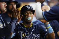 Tampa Bay Rays' Wander Franco celebrates in the dugout after scoring against the Houston Astros during the third inning of a baseball game Monday, April 24, 2023, in St. Petersburg, Fla. (AP Photo/Scott Audette)