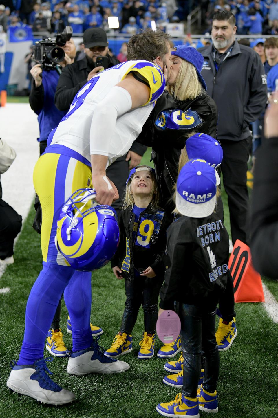 Los Angeles Rams quarterback Matthew Stafford (9) greets his family before a 2024 NFC wild card game against the Detroit Lions at Ford Field.