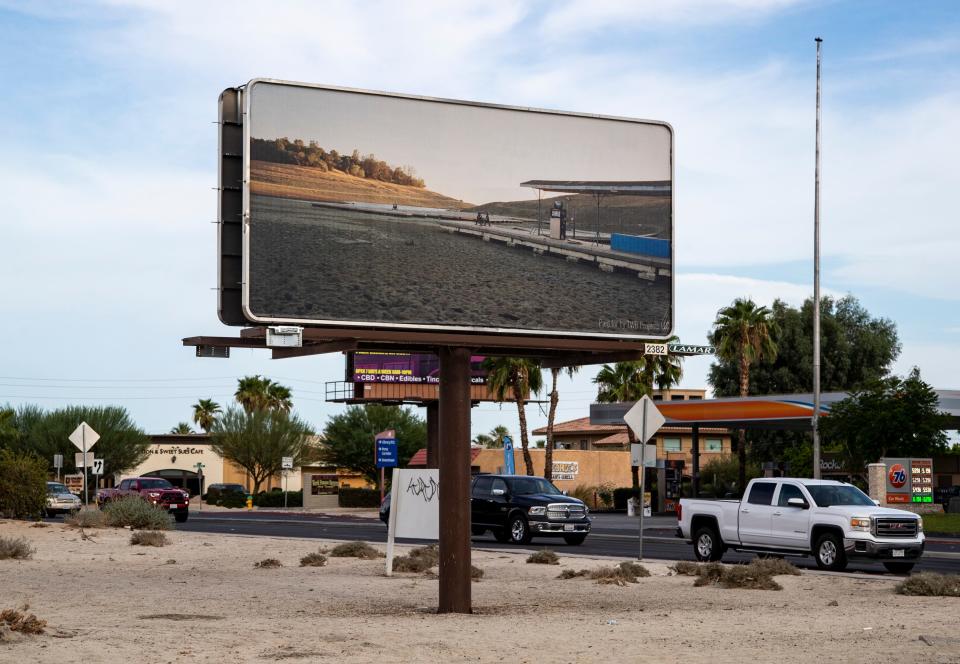 A billboard featuring a photograph by Thomas Broening depicting the drought is seen along Ramon Road in Cathedral City, Calif., Saturday, Aug. 13, 2022. 