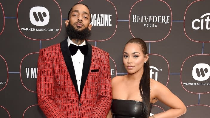 Nipsey Hussle (left) and Lauren London (right) arrive at the Warner Music Group Pre-Grammy Celebration at Nomad Hotel Los Angeles in February 2019. (Photo: Gregg DeGuire/Getty Images)