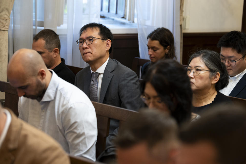 Representatives of the South Korean Embassy react during the trial of the captain of a river cruise boat in Budapest, Hungary, Tuesday, Sept. 26, 2023. The captain of a river cruise boat that collided with another vessel in Hungary's capital in 2019, killing at least 27 mostly South Korean tourists has been found guilty of negligence and sentenced to five years and six months in prison. (AP Photo/Denes Erdos)