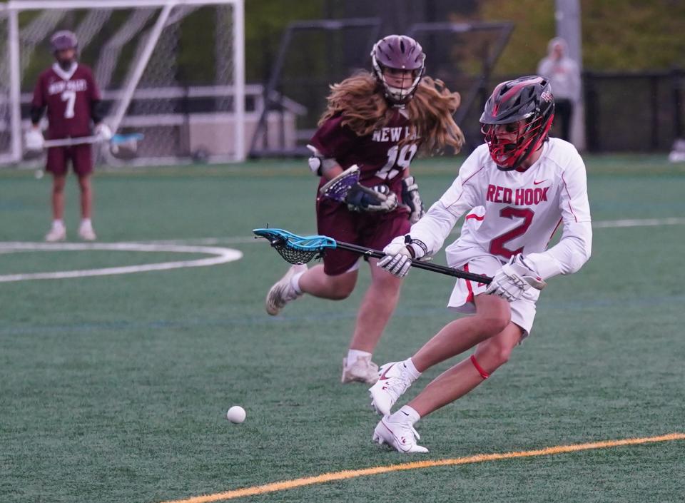 Red Hook's Brady Kelly looks to scoop a groundball during a May 3, 2023 boys lacrosse game against New Paltz.