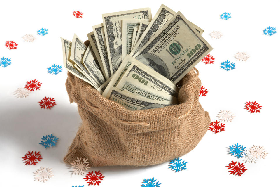 holiday bag full of money snowflakes