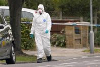 A forensic officer arrives to enter the Belfairs Methodist Church where a member of Parliament was killed on Friday, in Eastwood Road North, in Leigh-on-Sea, Essex, England, Saturday, Oct. 16, 2021. David Amess, a long-serving member of Parliament was stabbed to death during a meeting with constituents at a church in Leigh-on-Sea on Friday, in what police said was a terrorist incident. A 25-year-old man was arrested in connection with the attack, which united Britain's fractious politicians in shock and sorrow. (AP Photo/Alberto Pezzali)