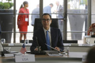 Treasury Secretary Steve Mnuchin attends a session at the G-7 Finance Wednesday July 17, 2019 in Chantilly, north of Paris. The Trump administration is objecting to France's plan to tax Facebook, Google and other U.S. tech giants, a rift that's overshadowing talks between seven longtime allies near Paris this week on issues ranging from digital currencies to trade. (AP Photo/Michel Euler)