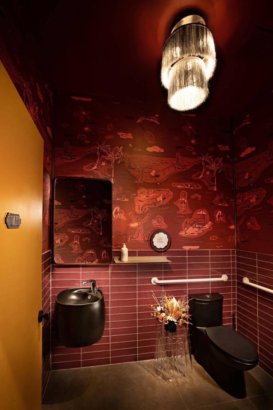 Even the bathrooms are a standout at Walrus Rodeo, with custom wallpaper from artist Beth Rhodes of Bethmade.