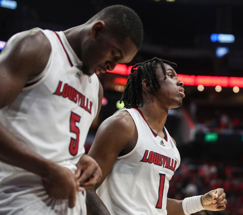 Louisville's Brandon Huntley-Hatfield, left, and Mike James returned after a difficult season. They expect a return to the program's former standard of basketball.