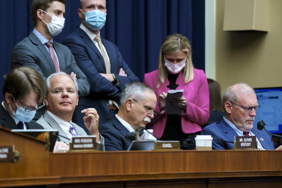 House Energy and Commerce members, seated from left, Rep. Brett Guthrie, R-Ky., Rep. David McKinley, R-W.Va., and Rep. Morgan Griffith, R-Va., listen during votes on amendments during work on the "Build Back Better" package, cornerstone of President Joe Biden's domestic agenda, at the Capitol in Washington, Wednesday, Sept. 15, 2021. (AP Photo/J. Scott Applewhite)