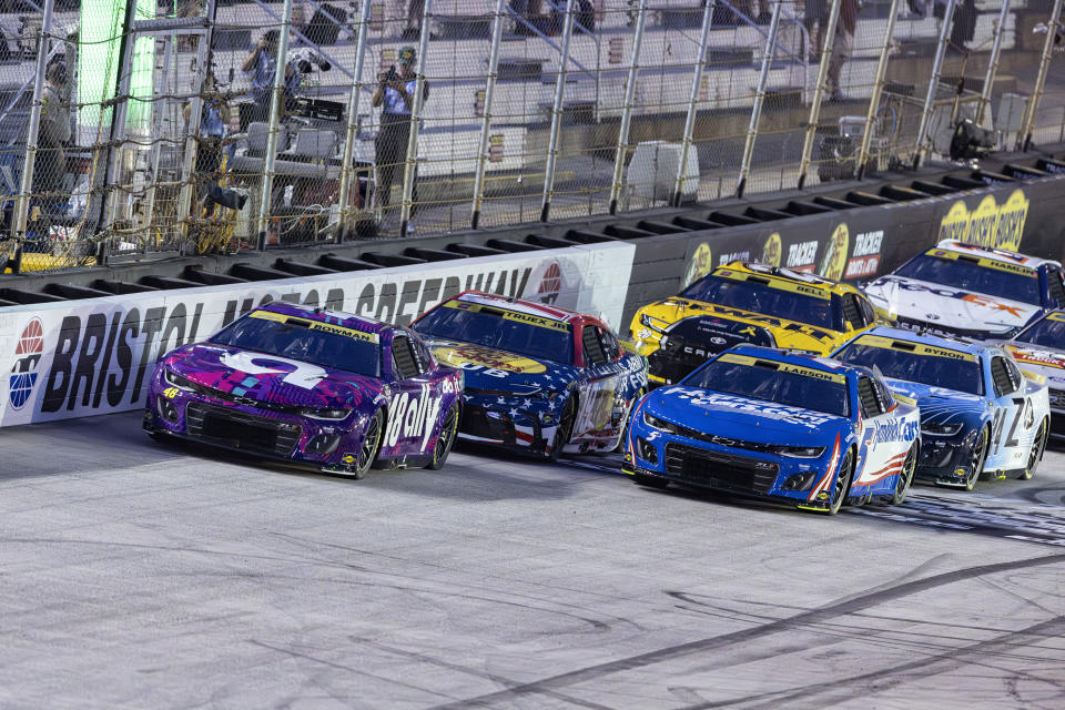 Alex Bowman (48) leads Kyle Larson (5) and Martin Truex Jr. (19) at the start of a NASCAR Cup Series auto race, Saturday, Sept. 21, 2024, in Bristol, Tenn. (AP Photo/Wade Payne)