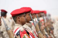 FILE PHOTO: Military police troops stand at attention during the funeral of Brigadier General Ahmad Saleh al-Uqaily in Marib, Yemen