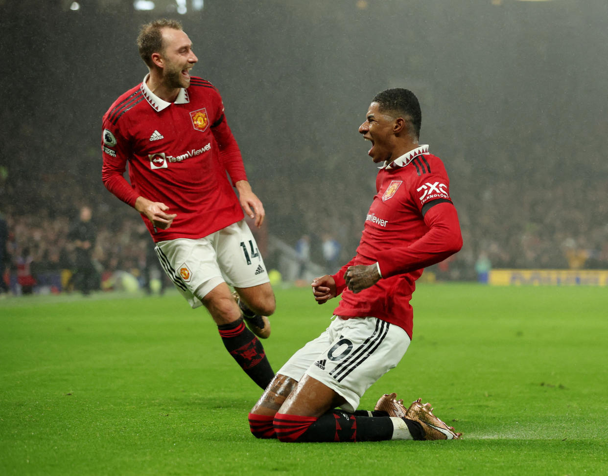 Manchester United's Marcus Rashford (right) celebrates a goal with teammate Christian Eriksen.