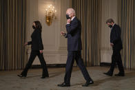 Vice President Kamala Harris, left, President Joe Biden, center, and Special Presidential Envoy for Climate John Kerry walk off after an event on climate change and green jobs, in the State Dining Room of the White House, Wednesday, Jan. 27, 2021, in Washington. (AP Photo/Evan Vucci)