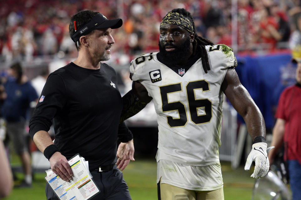 New Orleans Saints defensive coordinator Dennis Allen, left, celebrates with outside linebacker Demario Davis (56) after the team defeated the Tampa Bay Buccaneers during an NFL football game Sunday, Dec. 19, 2021, in Tampa, Fla. Allen was filling for Sean Payton as head coach after Payton was diagnosed with Covid-19. (AP Photo/Jason Behnken)