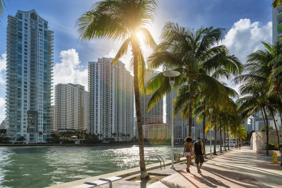 a water-side sidewalk in Florida with skyscrapers