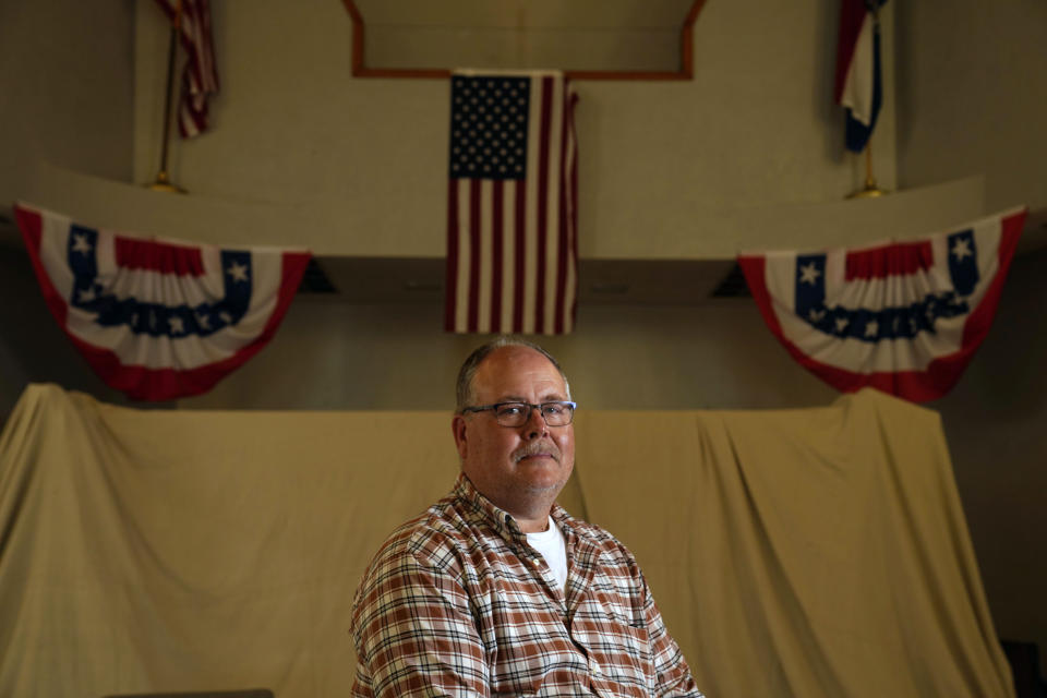 Mayor Willie Richter poses for a photo inside city hall Friday, May 27, 2022, in West Alton, Mo. The small city at the confluence of the Mississippi and Missouri rivers turned down a potential $106,341 of federal coronavirus aid. The rejected amount was almost half the size of the city's budget. From small towns to big cities, every government across the U.S. was offered a slice of $350 billion of federal coronavirus relief funds to help shore up their finances, cover pandemic-related costs and invest in community projects. (AP Photo/Jeff Roberson)