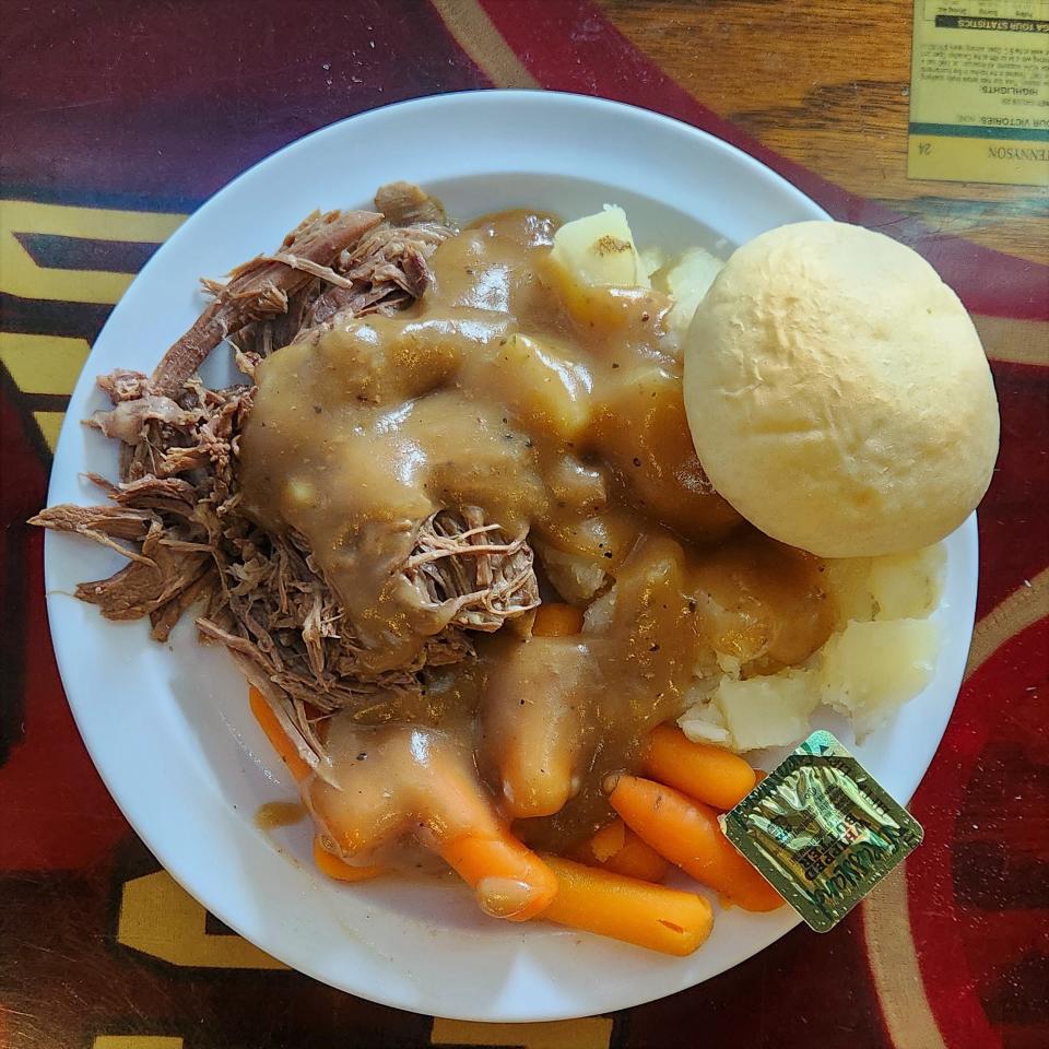 A lunch special at the Stockwell Inn of pot roast with mashed potatoes, gravy, carrots and a roll is served on Wednesday, July 19, 2023.