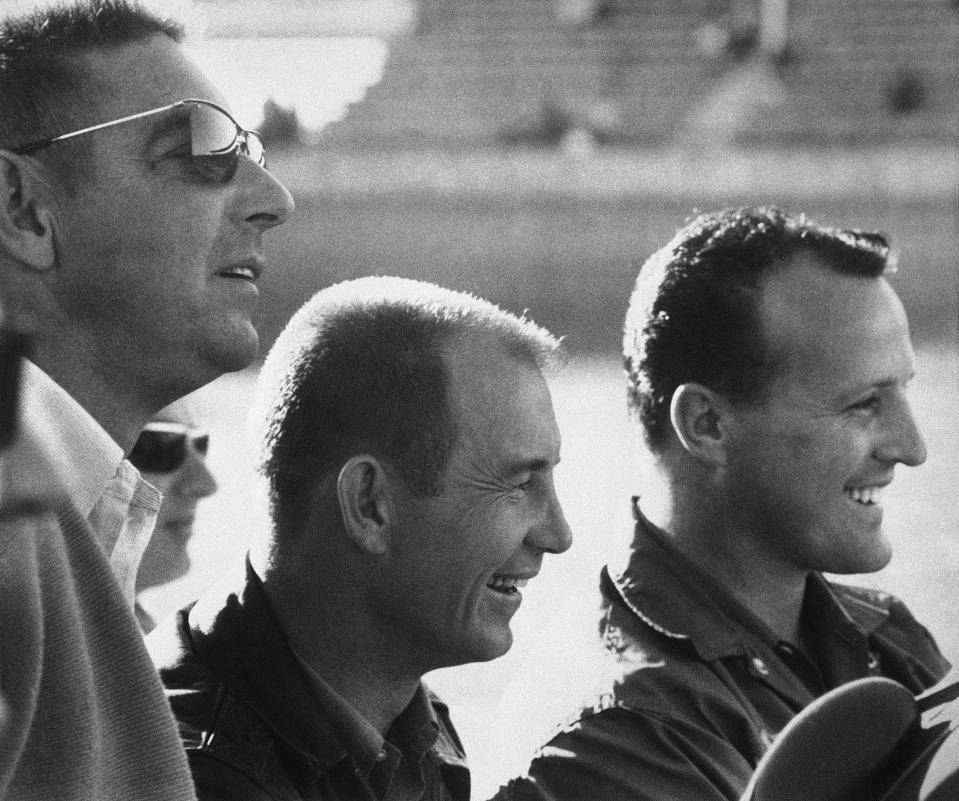 Fireball Roberts, Parnelli Jones and A.J. Foyt at Daytona in 1964.