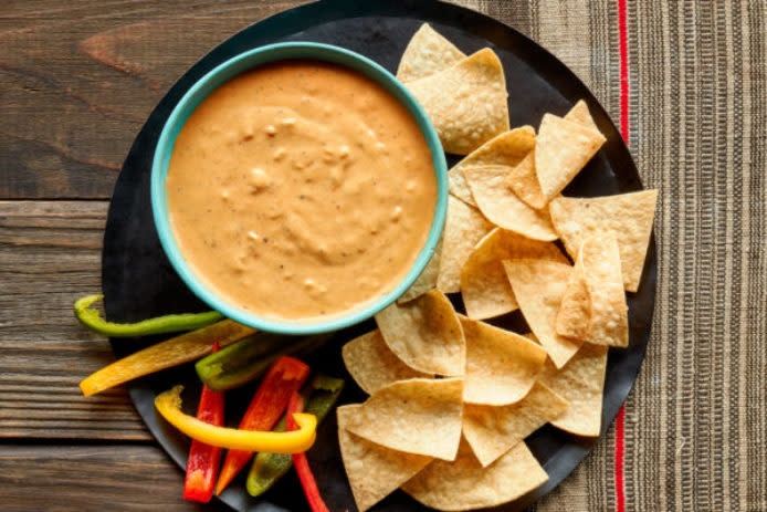 This chip-ready party dip is an indulgent Tex-Mex classic