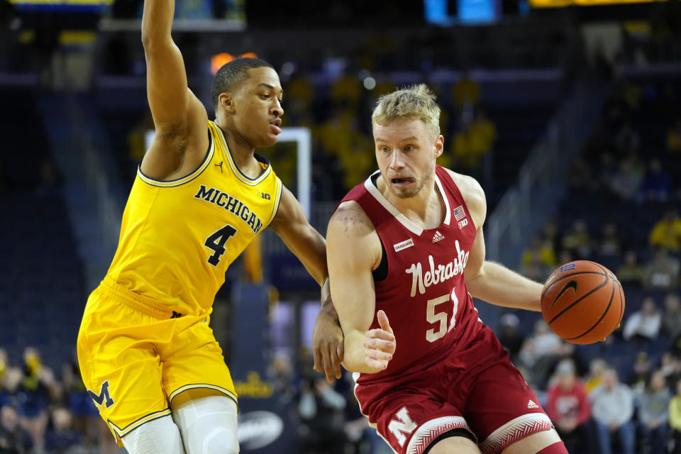 Nebraska forward Rienk Mast (51) is defended by Michigan guard Nimari Burnett (4) during the first half of an NCAA college basketball game, Sunday, March 10, 2024, in Ann Arbor, Mich. (AP Photo/Carlos Osorio)