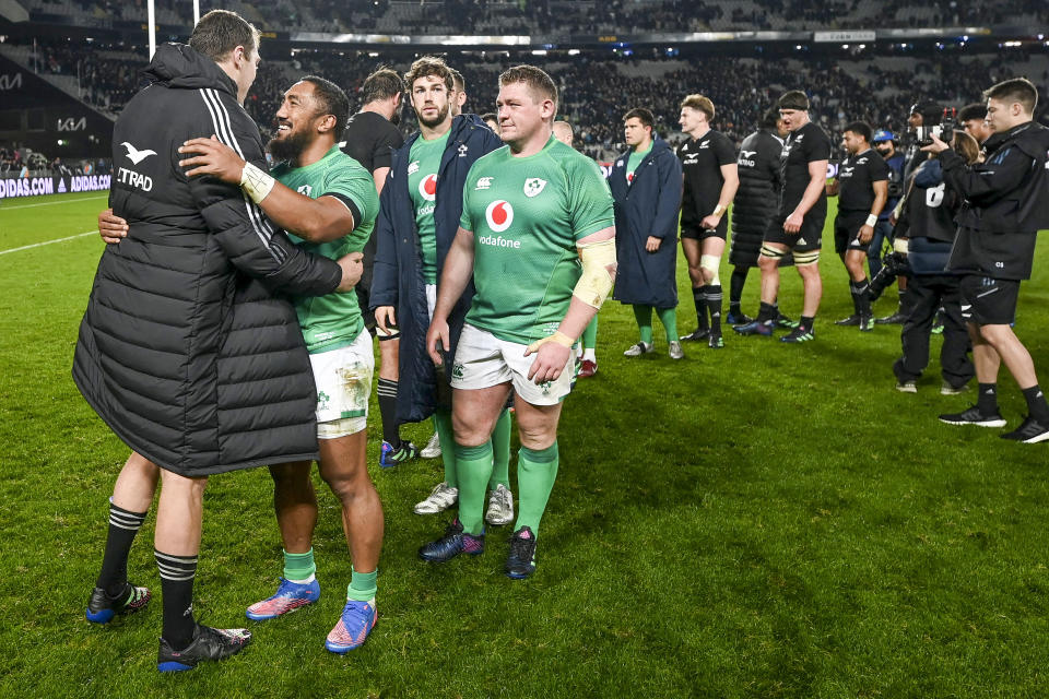 Ireland's Bundee Aki embraces New Zealand's Brodie Retallick following the rugby international between the All Blacks and Ireland at Eden Park in Auckland, New Zealand, Saturday, July 2, 2022. (Andrew Cornaga/Photosport via AP)