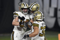 New Orleans Saints tight end Josh Hill (89) celebrates with teammates, including running back Michael Burton (32), after catching a 3-yard touchdown pass from quarterback Drew Brees during the second half of an NFL football game against the New Orleans Saints Sunday, Nov. 8, 2020, in Tampa, Fla. (AP Photo/Jason Behnken)