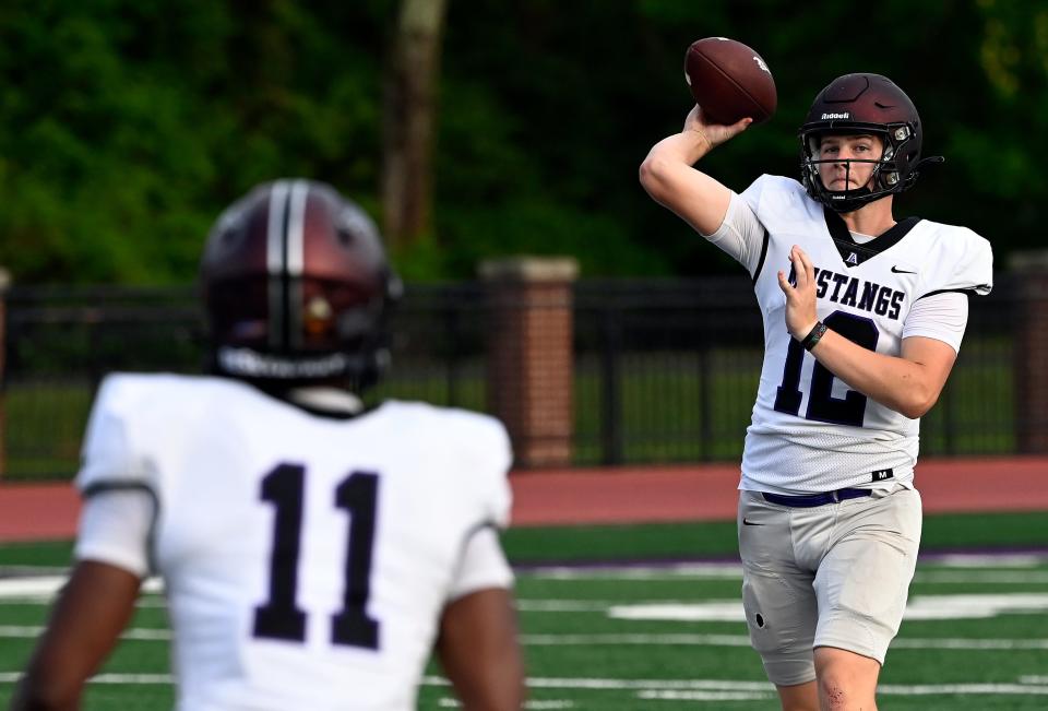 Lipscomb Academy quarterback (12) Jackson Kilburg throws to wide receiver Dillon Lorick (11) during a spring scrimmage Friday, May 12, 2023, in Nashville, Tenn. 