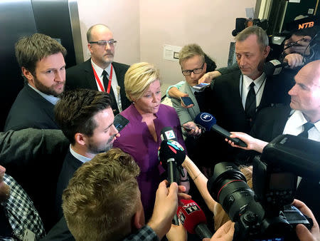 Norwegian Finance Minister Siv Jensen, leader of the rightwing Progress Party, speaks to media at the Norwegian Parliament in Oslo, Norway March 19, 2018. REUTERS/Joachim Dagenborg