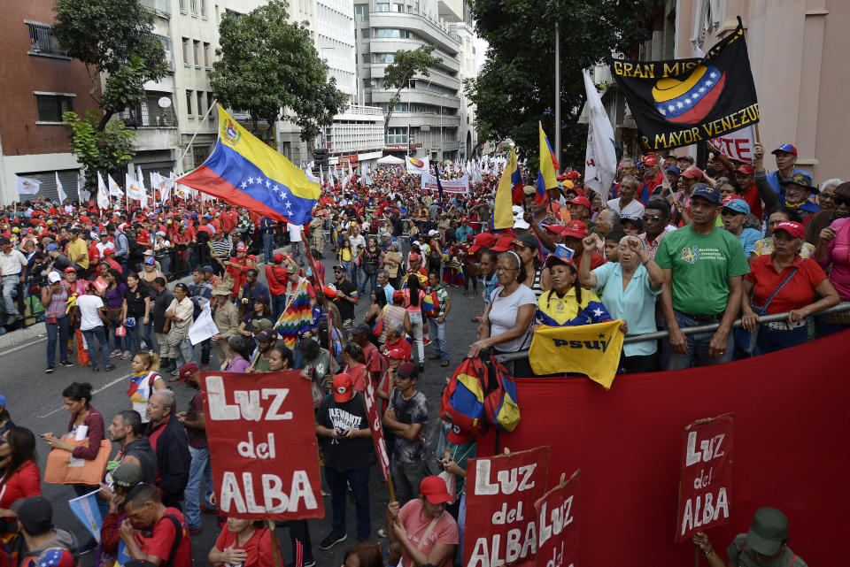 Pro-government supporters march to show their backing for President Nicolas Maduro, in Caracas, Venezuela, Saturday, Nov. 16, 2019. Crowds gathered in the Venezuelan’s capital for rival demonstrations on Saturday. Opposition leader Juan Guaido called for Saturday’s nationwide demonstrations to re-ignite a campaign against President Nicolas Maduro launched in January that has lost steam in recent months. (AP Photo/Matias Delacroix)