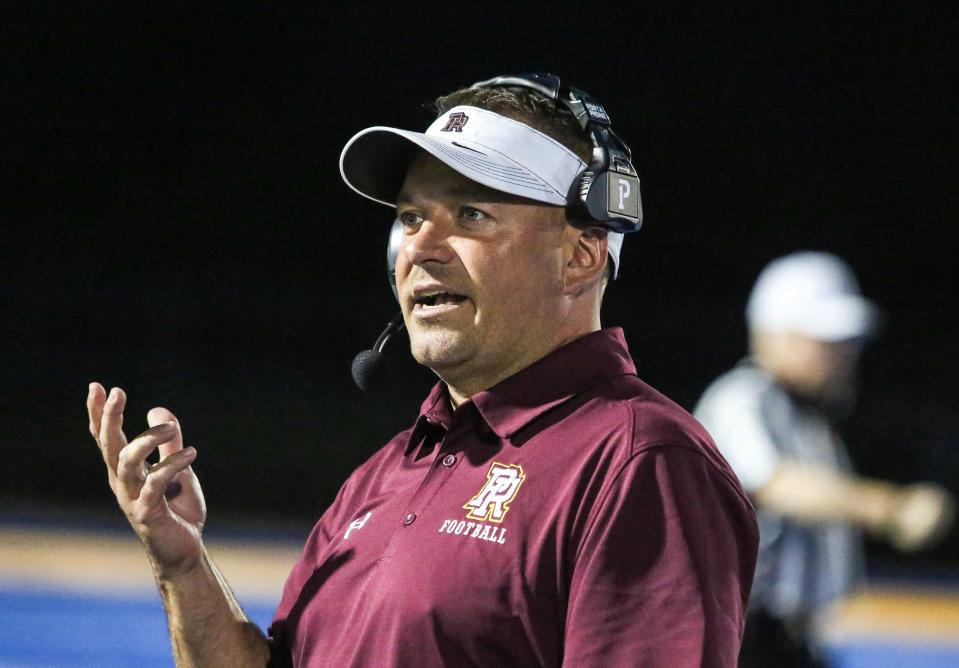 Park Ridge's head coach Tom Curry on the sidelines during the first half of a football game at Butler High School on September 22, 2023.