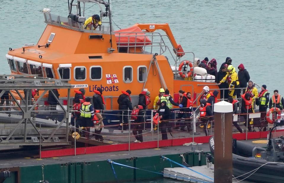 A group of people thought to be migrants are brought in to Dover, Kent, from the RNLI Dover Lifeboat following a small boat incident in the Channel on 31 January 2024. (PA)
