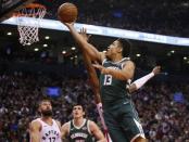 Dec 9, 2018; Toronto, Ontario, CAN; Milwaukee Bucks guard Malcolm Brogdon (13) goes up to make a basket against the Toronto Raptors at Scotiabank Arena. Milwaukee defeated Toronto. John E. Sokolowski-USA TODAY Sports