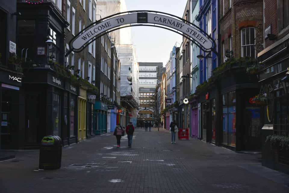 General view of a near empty Carnaby Street, in London, Saturday, Jan. 9, 2021, during England's third national lockdown to curb the spread of coronavirus. (AP Photo/Alberto Pezzali)