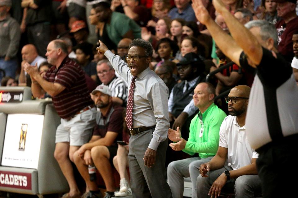 Benedictine coach Frank Williams motions to his team from the bench during the Class 4A quarterfinals on Wednesday March 1, 2023.