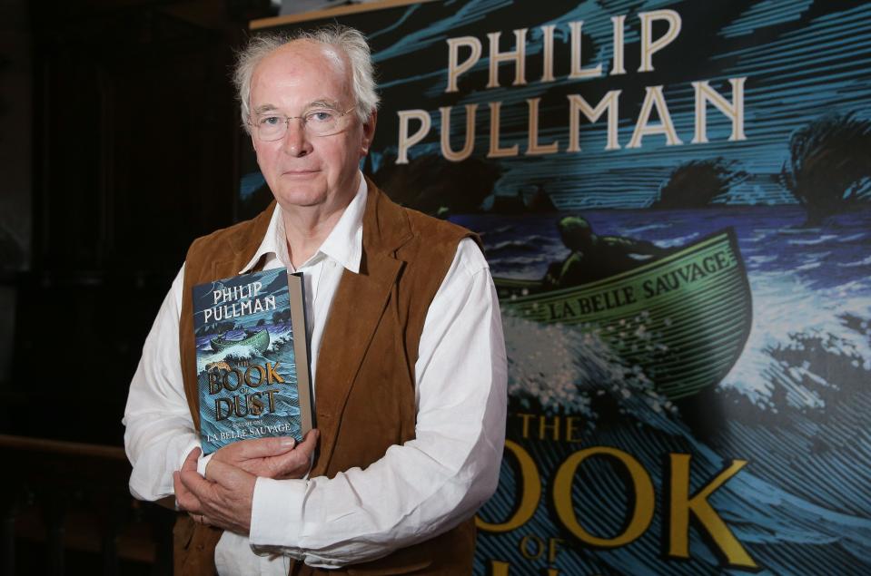 British author Philip Pullman poses with his new book 'La Belle Sauvage: The Book of Dust Volume One' during a photo call at Convocation House, Bodleian Libraries, in Oxford, southern England, on October 18, 2017. The 17-year wait for a return to the mystical world of British author Philip Pullman's "Dark Materials" series will end on October 19 with the release of "La Belle Sauvage", the first volume of a new trilogy. / AFP PHOTO / Daniel LEAL-OLIVAS        (Photo credit should read DANIEL LEAL-OLIVAS/AFP/Getty Images)