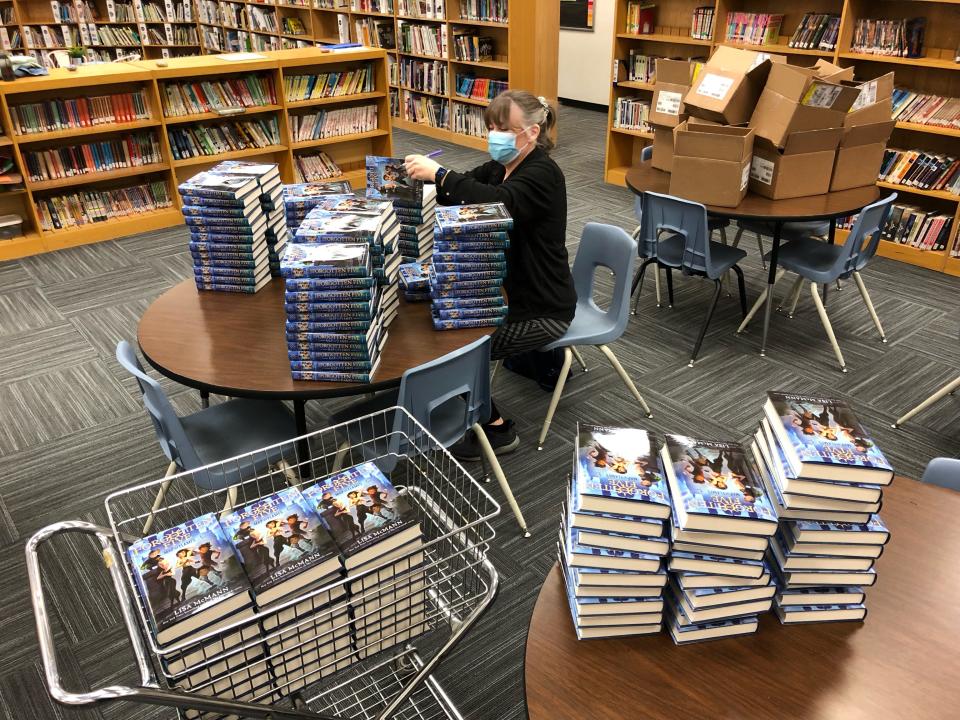 Lisa McMann signs copies of "Map of Flames," the debut book of "The Forgotten Five" series. McMann is a New York Times bestselling author.