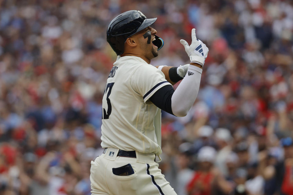 Minnesota Twins' Royce Lewis celebrates as he reaches home plate after a solo home run during the third inning in Game 1 of an AL wild-card baseball playoff series Tuesday, Oct. 3, 2023, in Minneapolis. (AP Photo/Bruce Kluckhohn)