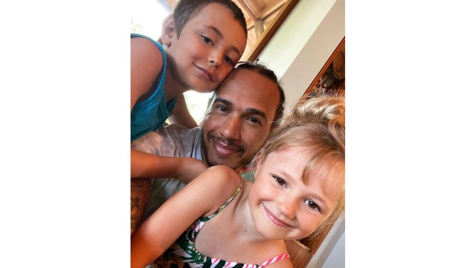 Lewis Hamilton with his niece and nephew