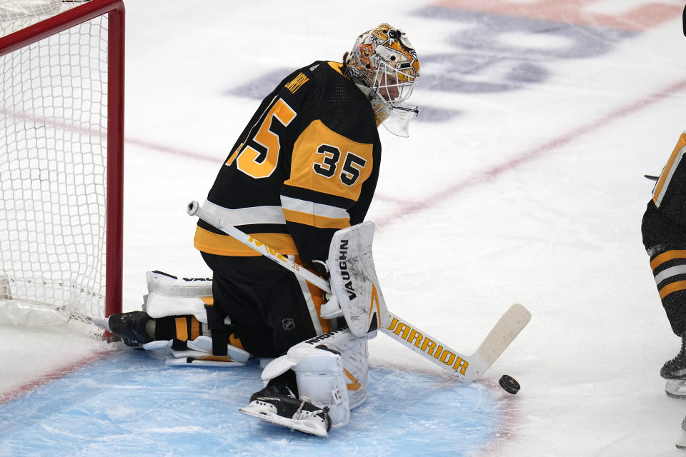 Pittsburgh Penguins goaltender Tristan Jarry blocks a shot during the first period of an NHL hockey game against the Seattle Kraken in Pittsburgh, Monday, Jan. 15, 2024. (AP Photo/Gene J. Puskar)