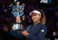 Tennis - Australian Open - Women's Singles Final - Melbourne Park, Melbourne, Australia, January 26, 2019. Japan's Naomi Osaka poses with the trophy after winning her match against Czech Republic's Petra Kvitova. REUTERS/Lucy Nicholson