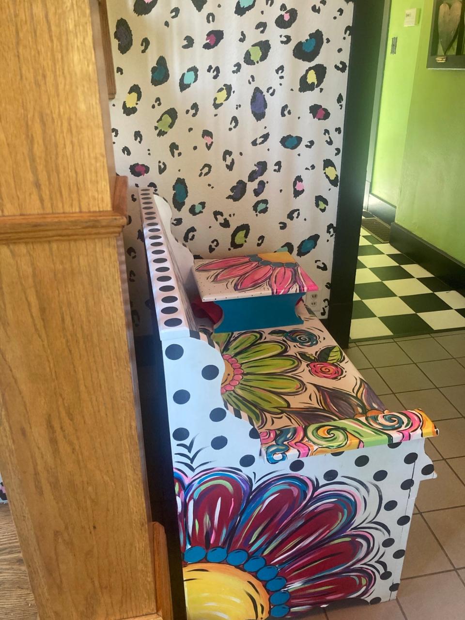 A brightly-painted bench sits in the Be Lovely House, a residential component of the Wooden It Be Lovely program started at Douglas Avenue United Methodist Church nine years ago. Up to four women who are recovering from forms of addiction or who have experienced poverty or abuse are expected to live in the house. The women work for Wooden It Be Lovely, which refurbishes furniture, among other activities.