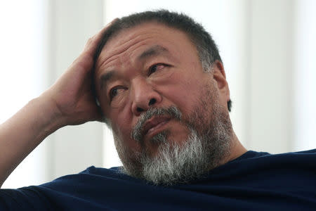 Chinese artist Ai Weiwei gestures during a news conference for his exhibition "Restablecer Memorias" displayed at the University Museum of Contemporary Art (MUAC) in Mexico City, Mexico, April 11, 2019. REUTERS/Edgard Garrido/Files