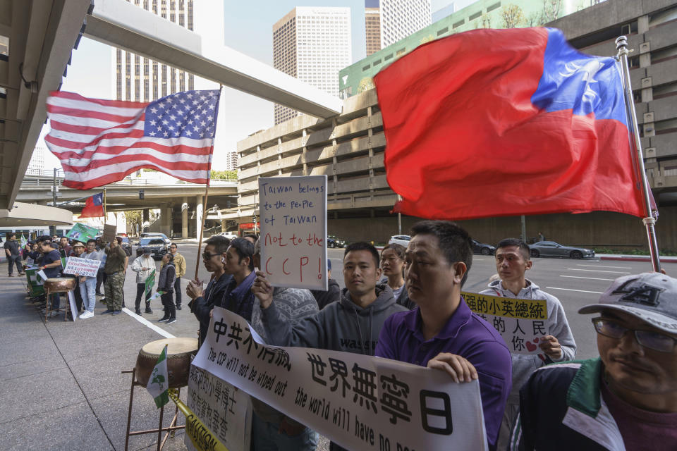 Supporters of Taiwan's President Tsai Ing-wen await her arrival outside the Westin Hotel in Los Angeles Tuesday, April 4, 2023. (AP Photo/Damian Dovarganes)