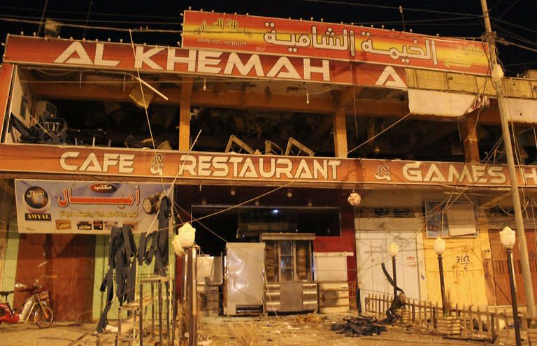 A coffee shop that was damaged in a bomb blast in Fallujah, west of Baghdad, on May 17, 2013. Bombs targeting Sunnis, including two near a mosque and one at a funeral procession, have killed 67 people across Iraq, officials said, after dozens died in two days of attacks on Shiites