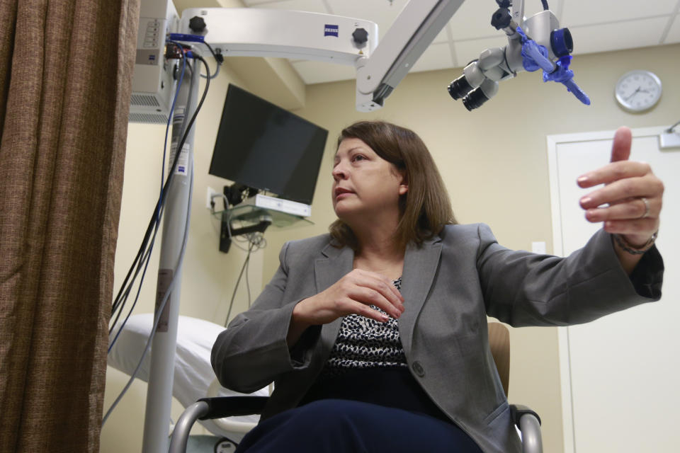 Director of the forensic nursing program at the Bon Secours St. Mary's Hospital, Bonnie Price, speaks during an interview in the examination room at the hospital in Richmond, Va., Wednesday, Oct. 30, 2019. “Being a forensic nurse can be emotionally toxic at times," Price said. “It is work that you can't carry home and talk to your family about.” (AP Photo/Steve Helber)