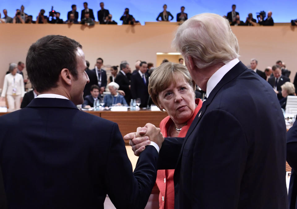 President Donald Trump&nbsp;alongside French President Emmanuel Macron&nbsp;and German Chancellor Angela Merkel at the start of the G20 meeting in Hamburg, Germany, on July 7, 2017.&nbsp; (Photo: AFP Contributor via Getty Images)