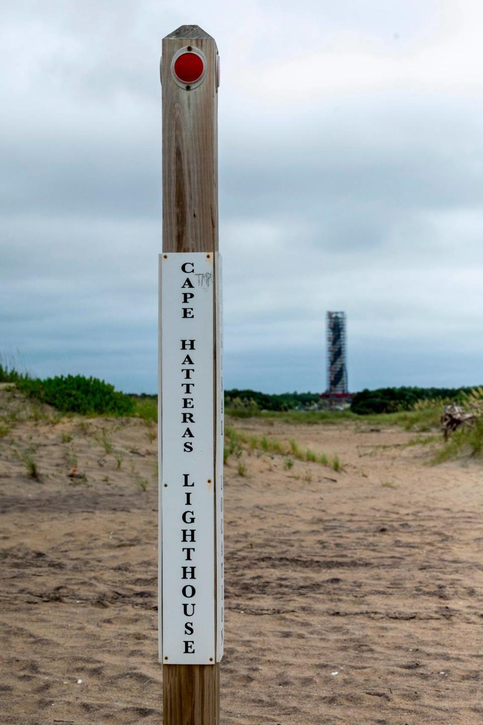 A post shows the original location of the Cape Hatteras Lighthouse. The lighthouse was famously moved over 23 days in June and July 1999, when it was cut from its granite foundation, lifted onto rails and rolled 2,900 feet inland.