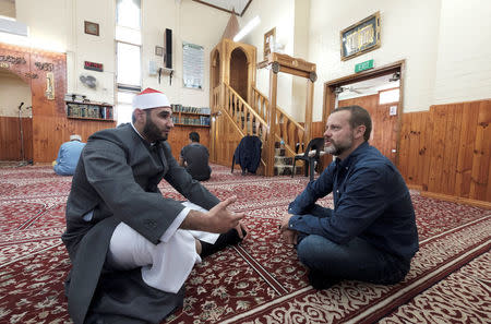 Australian journalist Dean Yates talks with Imam Alaa El Zokmat at the Elsedeaq Heidelberg Mosque, located in the Melbourne suburb of Heidelberg in Australia, March 2, 2018. Picture taken March 2, 2018. REUTERS/Luis Enrique Ascui