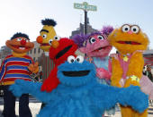 FILE - In this Feb. 10, 2010 file photo, characters from Sesame Street Live appear on the street by Madison Square Garden to celebrate the 30th anniversary of the live touring stage shows based on the PBS television series in New York. From left are Ernie, Bert, Elmo, Cookie Monster (foreground), Abby Cadabby, and Zoe. Iconic actress Sally Field and foundational children’s show Sesame Street top this year’s class of Kennedy Center Honors recipients. Other chosen to receive the award for lifetime achievement in the arts include singer Linda Ronstadt, conductor Michael Tilson Thomas and the R&B group Earth, Wind and Fire. (AP Photo/Kathy Willens, File)