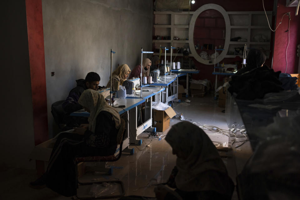 Palestinian women sew diapers in Rafah, southern Gaza Strip, Thursday, Feb. 15, 2024. Palestinians in Gaza have experienced severe shortages of basic necessities since the war began on Oct. 7. (AP Photo/Fatima Shbair)