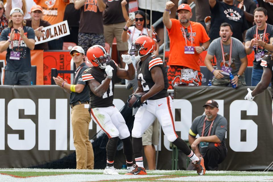 Browns wide receivers Amari Cooper (right) and Donovan Peoples-Jones celebrate after Cooper caught a TD pass against the New York Jets during the first half, Sunday, Sept. 18, 2022, in Cleveland.